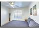 Comfortable bedroom with a soft bed, white walls, and tasteful wall decor at 13280 W Caribbean Ln, Surprise, AZ 85379