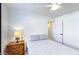 Bright bedroom showcasing a bed, nightstand with lamp, and ample space at 13280 W Caribbean Ln, Surprise, AZ 85379