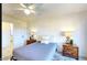 Comfortable bedroom with neutral tones, bedside lamps, and a ceiling fan at 13280 W Caribbean Ln, Surprise, AZ 85379