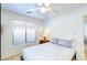 Simple bedroom setup featuring a comfortable bed with a window at 13280 W Caribbean Ln, Surprise, AZ 85379