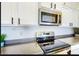 Well-maintained kitchen featuring stainless steel appliances, sleek countertops, and ample storage, ready for culinary endeavors at 13280 W Caribbean Ln, Surprise, AZ 85379