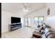 Cozy living room featuring a modern TV setup and comfortable leather seating at 13280 W Caribbean Ln, Surprise, AZ 85379