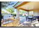 Outdoor kitchen features built-in grill and bar seating in a covered patio area perfect for backyard entertaining at 13280 W Caribbean Ln, Surprise, AZ 85379