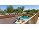 An aerial view of the pool, fire pit, and playground area in the neighborhood at 13724 W Luke Ave, Litchfield Park, AZ 85340