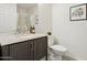 Bathroom shows a granite vanity, toilet and shower at 13724 W Luke Ave, Litchfield Park, AZ 85340