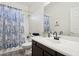 Bathroom features a single vanity with dark cabinets, toilet, and shower over bath at 13724 W Luke Ave, Litchfield Park, AZ 85340