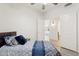 This bedroom is furnished with a queen bed and has a double door entry at 13724 W Luke Ave, Litchfield Park, AZ 85340