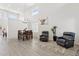 Bright and spacious dining area with tall windows, wood-look floors and high ceilings at 13724 W Luke Ave, Litchfield Park, AZ 85340