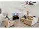 Open-concept living area featuring neutral tones, wood-look floors, and plenty of natural light at 13724 W Luke Ave, Litchfield Park, AZ 85340