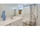 Bright bathroom with modern vanity, full mirror, and decorative shower curtain at 1516 W Ridge Rd, Apache Junction, AZ 85120