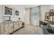 Charming bedroom featuring a decorative cabinet, workspace and light-filled window at 1516 W Ridge Rd, Apache Junction, AZ 85120