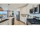 Modern kitchen featuring stainless steel appliances and white cabinets at 1516 W Ridge Rd, Apache Junction, AZ 85120