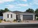 Charming single-story home with stone accents, manicured landscaping, and a two-car garage at 15951 W El Cortez Pl, Surprise, AZ 85387