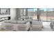 Bright living room featuring contemporary furniture, a fireplace, and sliding glass doors to the backyard at 16035 W Questa Dr, Surprise, AZ 85387