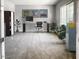 Spacious home office with a large window, a work desk, and ample storage options at 16035 W Questa Dr, Surprise, AZ 85387
