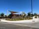 Community playground with shade structures, landscaping, and accessible via paved sidewalks at 16035 W Questa Dr, Surprise, AZ 85387