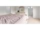 Cozy primary bedroom with neutral carpet, adjacent to a bright bathroom at 16221 W Prickly Pear Trl, Surprise, AZ 85387