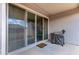 Outdoor patio with a large sliding glass door leading to the interior of the home, and a grill at 16221 W Prickly Pear Trl, Surprise, AZ 85387
