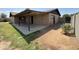 A large covered patio and gravel area creates an inviting atmosphere for gatherings and relaxation at 1714 W Villa Rita Dr, Phoenix, AZ 85023