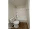 Clean bathroom featuring a white tub/shower combination and matching toilet creating a serene space at 1714 W Villa Rita Dr, Phoenix, AZ 85023