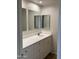Bathroom with updated vanity featuring modern countertop and cabinetry providing ample storage at 1714 W Villa Rita Dr, Phoenix, AZ 85023