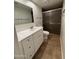This is a bathroom with a new vanity, ceramic tile, and shower at 1714 W Villa Rita Dr, Phoenix, AZ 85023