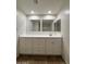 The bathroom has a modern vanity, and updated cabinetry for a clean aesthetic at 1714 W Villa Rita Dr, Phoenix, AZ 85023