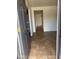 Inviting entryway features neutral tile flooring, offering a clean and modern welcome at 1714 W Villa Rita Dr, Phoenix, AZ 85023