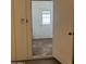 Entryway view into the home featuring tile floors and access to a bedroom at 1714 W Villa Rita Dr, Phoenix, AZ 85023