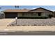 Charming single-story home featuring a well-maintained front yard with desert landscaping and a two-car garage at 1714 W Villa Rita Dr, Phoenix, AZ 85023