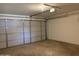 Clean garage interior featuring a white garage door with updated opener at 1714 W Villa Rita Dr, Phoenix, AZ 85023