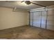 Garage interior showcases a spacious area with a functional garage door and opener at 1714 W Villa Rita Dr, Phoenix, AZ 85023