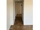 Hallway with tile flooring leads to bedrooms and bathrooms in this well-maintained home at 1714 W Villa Rita Dr, Phoenix, AZ 85023