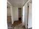 Hallway with access to closet, and carpeted rooms in the background; easy living awaits at 1714 W Villa Rita Dr, Phoenix, AZ 85023
