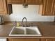 A clean kitchen sink featuring a modern faucet and tile floors at 1714 W Villa Rita Dr, Phoenix, AZ 85023