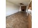 Spacious living room with a brick fireplace and tile flooring at 1714 W Villa Rita Dr, Phoenix, AZ 85023