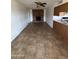 Open living room with a brick fireplace, tile flooring, and ceiling fan at 1714 W Villa Rita Dr, Phoenix, AZ 85023