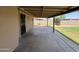 Open patio space with view of backyard featuring lawn and fencing at 1714 W Villa Rita Dr, Phoenix, AZ 85023