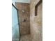 This shower stall features decorative ceramic tiling and a sliding door at 1714 W Villa Rita Dr, Phoenix, AZ 85023