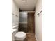 This shower stall features decorative ceramic tiling and a sliding door at 1714 W Villa Rita Dr, Phoenix, AZ 85023