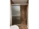 This shower stall features decorative ceramic tiling and a sliding door at 1714 W Villa Rita Dr, Phoenix, AZ 85023