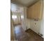 Functional storage room with ample built-in cabinets and tile flooring at 1714 W Villa Rita Dr, Phoenix, AZ 85023