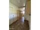 Storage room featuring numerous cabinets for storing essentials, enhanced by tile flooring at 1714 W Villa Rita Dr, Phoenix, AZ 85023