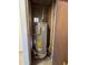 Enclosed water heater unit with energy guide and essential connections at 1714 W Villa Rita Dr, Phoenix, AZ 85023