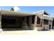 Inviting home featuring covered parking and a well-maintained facade under a beautiful sky at 17200 W Bell Rd # 47, Surprise, AZ 85374