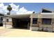 Charming home exterior with covered parking and well-maintained landscaping under sunny skies at 17200 W Bell Rd # 47, Surprise, AZ 85374