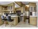 View of the kitchen, breakfast bar and stainless appliances in an open concept home at 17200 W Bell Rd # 47, Surprise, AZ 85374