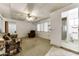 View of the living room showing a sofa, carpet, access to the bathroom and the bedroom at 17200 W Bell Rd # 47, Surprise, AZ 85374