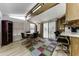 Living room boasts natural lighting, bar seating, and laminate flooring at 17200 W Bell Rd # 47, Surprise, AZ 85374
