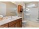 Bright bathroom featuring double vanity, updated fixtures, and a shower/tub combination at 17886 W Brookwood Dr, Goodyear, AZ 85338